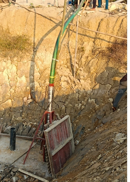 Thumba submersible pumpset being lowered into an excavated pit during erection at the Assam tea estate, Guwahati