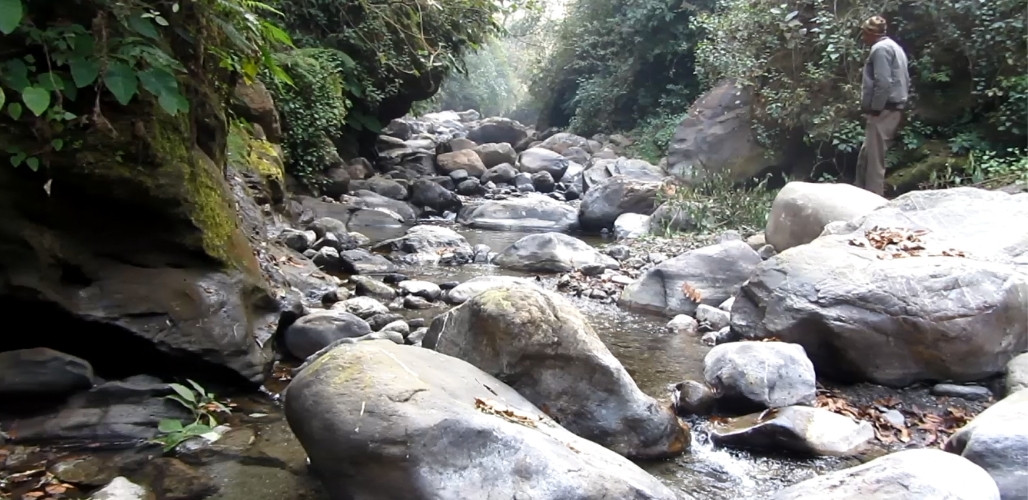 Natural mountain stream at Patkot, Uttarakhand — sole water source for Mr. Ram's RainGun system